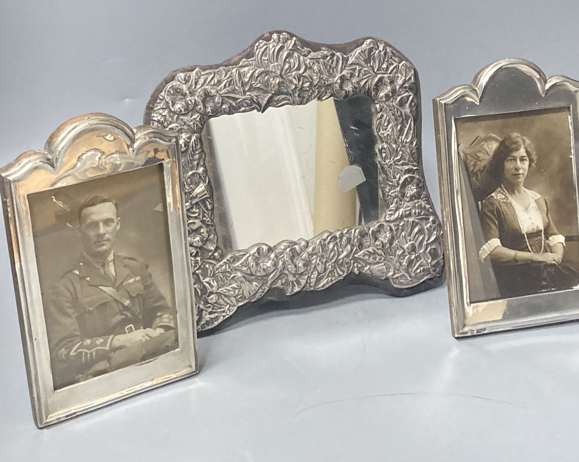 A pair of George V silver mounted photograph frames, Boots Pure Drug Company, Birmingham, 1918, 19.5cm & 1 other frame.